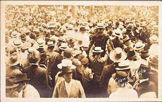 Spectators at the lynching of Jesse Washington, one man raised for a better view. May 16, 1916, Waco, Texas. Gelatin silver print. Real photo postcard. 5 1/2 x 3 1/2